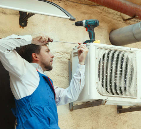 hvac technician doing repair